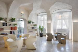 a living room with a table and chairs at Three Storks in Prague