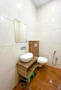 a bathroom with a sink and a toilet at New sheth bnb golden temple in Amritsar