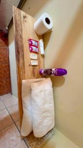 a roll of toilet paper and a roll of toilet paper on a wall at Accommodation #7 in Copán Ruinas