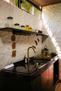 a kitchen with a sink and a counter top at Vilarejo in Belém +66 photos