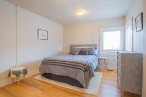 a bedroom with a bed and a window at Sleeps 10 Walkable to Everything Pets Game Room in Salida