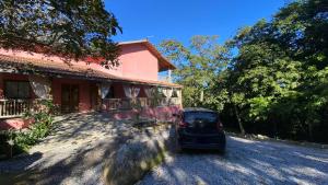 a car parked in front of a house at Pousada Refugio da Ilha Ilhabela in Ilhabela +17 photos