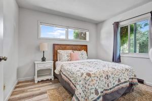 a bedroom with a bed and a window at 4BR Downtown Basecamp - Walk to Everything in Salida