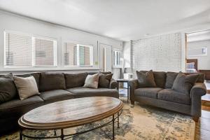 a living room with a couch and a coffee table at 4BR Downtown Basecamp - Walk to Everything in Salida +28 photos