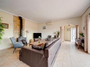 a living room with a couch and a table at Villa in El Agar with Private Pool and Beaches in Mina Blanca +32 photos