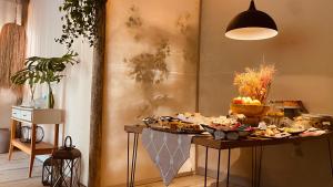 a table with a buffet of food on it at Pousada Refugio da Ilha Ilhabela in Ilhabela