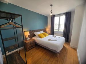 a bedroom with a bed with a ladder and a window at Atria SILS in Caen