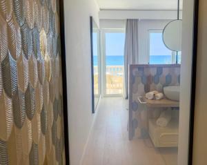 a room with a bathroom with a view of the ocean at Ivory Dimora di Charme in Terracina +41 photos