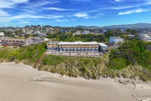 an aerial view of a building on the beach at Sailor Jack Oceanfront Motel in Lincoln City +24 photos