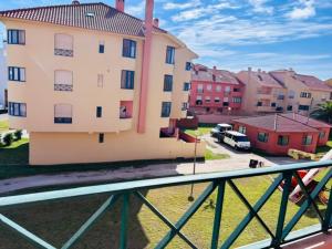 a view of a building from a balcony at SwordFish Beach Escape Apartment in Atouguia da Baleia