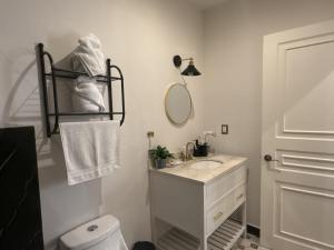 a bathroom with a sink and a toilet and a mirror at Luna Toscana in Santeagueda +27 photos