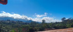 a view of the mountains from a house at Pousada Alforria Lavras Novas centro in Lavras Novas