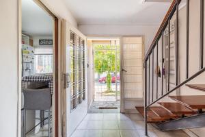 a hallway of a house with a staircase and a door at Super duplex Martinez in Martínez +72 photos