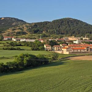 a small town in the middle of a green field at Casa Rural El Jaral in Orihuela del Tremedal
