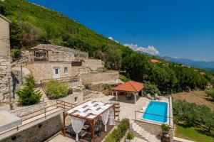 an external view of a house with a swimming pool at Villa Tea in Cavtat