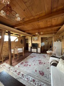 a living room with a couch and a table at Boravak Tarhaniš Rožaje in Rožaje