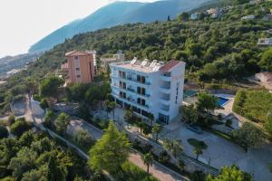 an aerial view of a building with a mountain at Hotel Palasa in Palasë