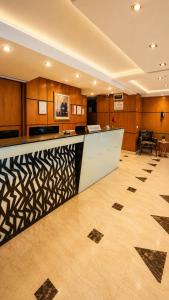 a lobby with a reception desk in a building at Silver Suites Hotel Casablanca in Casablanca +58 photos
