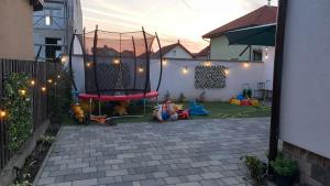 a backyard with a playground with a trampoline at Casa A&A Stefan Livada in Livada