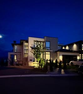 a house at night with its lights on at Luxury EW Bed & Breakfast in Abbotsford