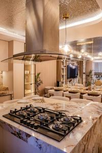 a kitchen with a stove top on a counter at CB Oasis Signature in Ica