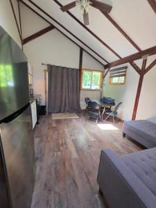 a living room with a couch and a table at Noah's Ark Campground in Malakwa