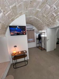 a room with a table and a painting on a wall at Buonaventura house2 in Triggiano