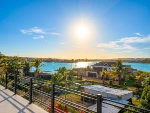 a view of the water from the balcony of a house at Itza Living Apartments in Flores +9 photos