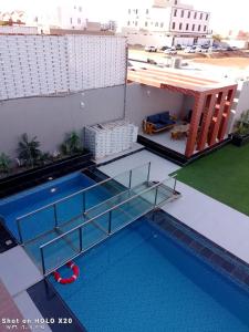 an overhead view of a swimming pool on a building at BELLA ViTA in Jeddah