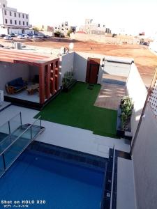 a view of a house with a swimming pool at BELLA ViTA in Jeddah +3 photos
