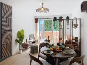 a living room with a table with food on it at L'Amour des Îles - Centre - Plage - Parking in Cabourg
