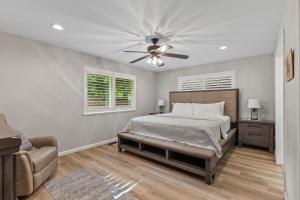 a bedroom with a bed and a ceiling fan at Riverside Harbor House in Post Falls ID in Post Falls