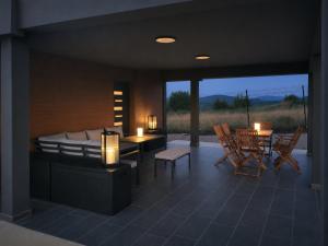 a living room with a bed and a table and chairs at Peak Vista A-Frame in Sarajevo