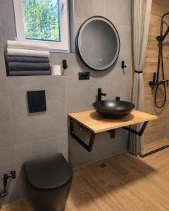 a bathroom with a sink and a mirror at Peak Vista A-Frame in Sarajevo +36 photos