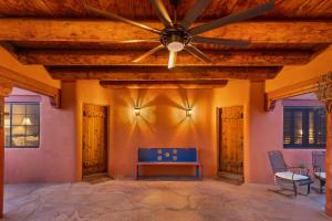 a ceiling fan on a patio with a ping pong table at Cereus Vista in Tucson