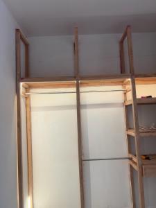 a closet with two glass doors in a room at Salo in Georgetown
