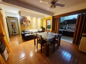 a living room with a table and a couch at Villa Lainez in Villa Mercedes
