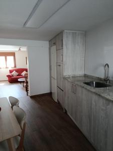 a kitchen with a sink and a counter top at La calma de Arnedillo in Arnedillo +7 photos