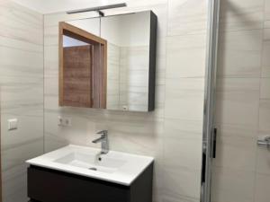 a bathroom with a sink and a mirror at Murleben Top 06 in Stadl an der Mur +23 photos