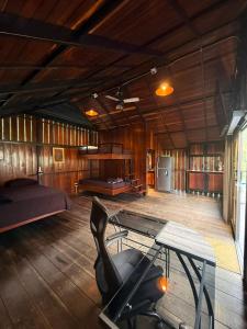 a room with a gym with a bed and a chair at AJ EcoGlamping in Santo Domingo