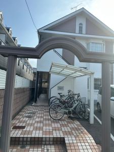 a group of bikes parked in a garage at Guest House "Ro"Hieda B101 in Shimonoseki