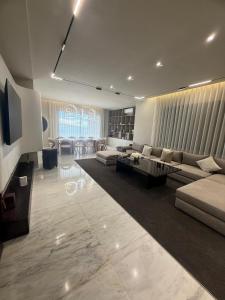 a living room with a couch and a table at Villa élite in Tangier