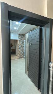 an open door to a room with a hallway at Appartement Agadir T2 pour couples maries et familles in Agadir +1 photo