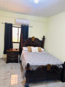 a bedroom with a large bed and a window at New hotel neo in Santa Cruz de Barahona
