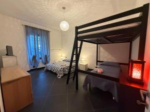 a bedroom with a bunk bed in a room at Casa Giulia in Taviano