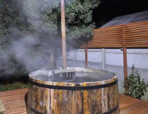 a wooden barrel with smoke coming out of it at Hospedaje Francesco in Puerto Montt