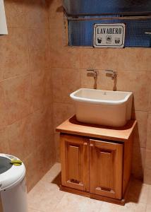 a bathroom with a sink and a toilet at Villa Lainez in Villa Mercedes +42 photos