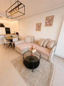 a living room with a couch and a table at Spacious Apartment 1BR with Sofa bed near Atomium, Expo 12 and ING Arena in Wemmel