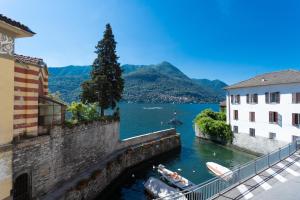 a view of a river between two buildings at Romantic Pier by Rent All Como in Carate Urio