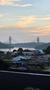 a view of a city with a bridge in the background at Hotel Omega in Oiapoque